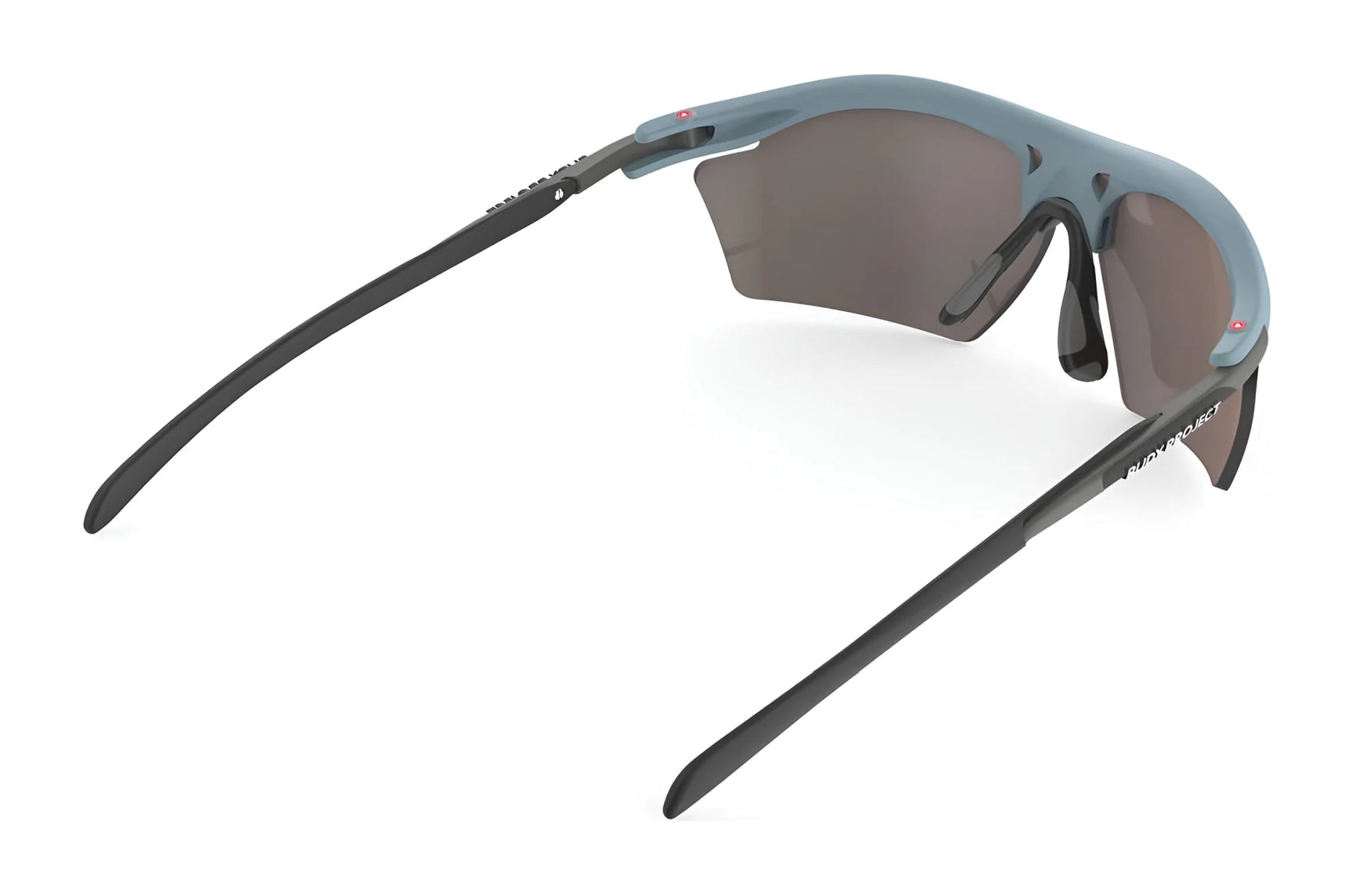 The Rudy Project Rydon Slim Sunglasses, by Rudy Project, feature an angular design with blue frames and dark lenses, viewed from the side, offering UV protection to shield your eyes from harmful rays. The Rudy Project Rydon Slim Sunglasses, by Rudy Project, feature an angular design with blue frames and dark lenses, viewed from the side, offering UV protection to shield your eyes from harmful rays.