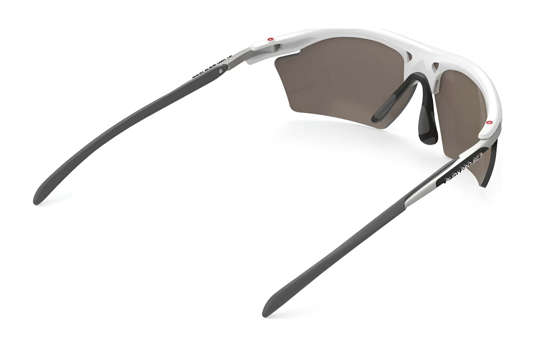The Rudy Project Rydon Slim Sunglasses feature a sleek white and gray design with tinted, UV-protected lenses. These stylish shades offer optional interchangeable lenses for maximum versatility. The Rudy Project Rydon Slim Sunglasses feature a sleek white and gray design with tinted, UV-protected lenses. These stylish shades offer optional interchangeable lenses for maximum versatility.