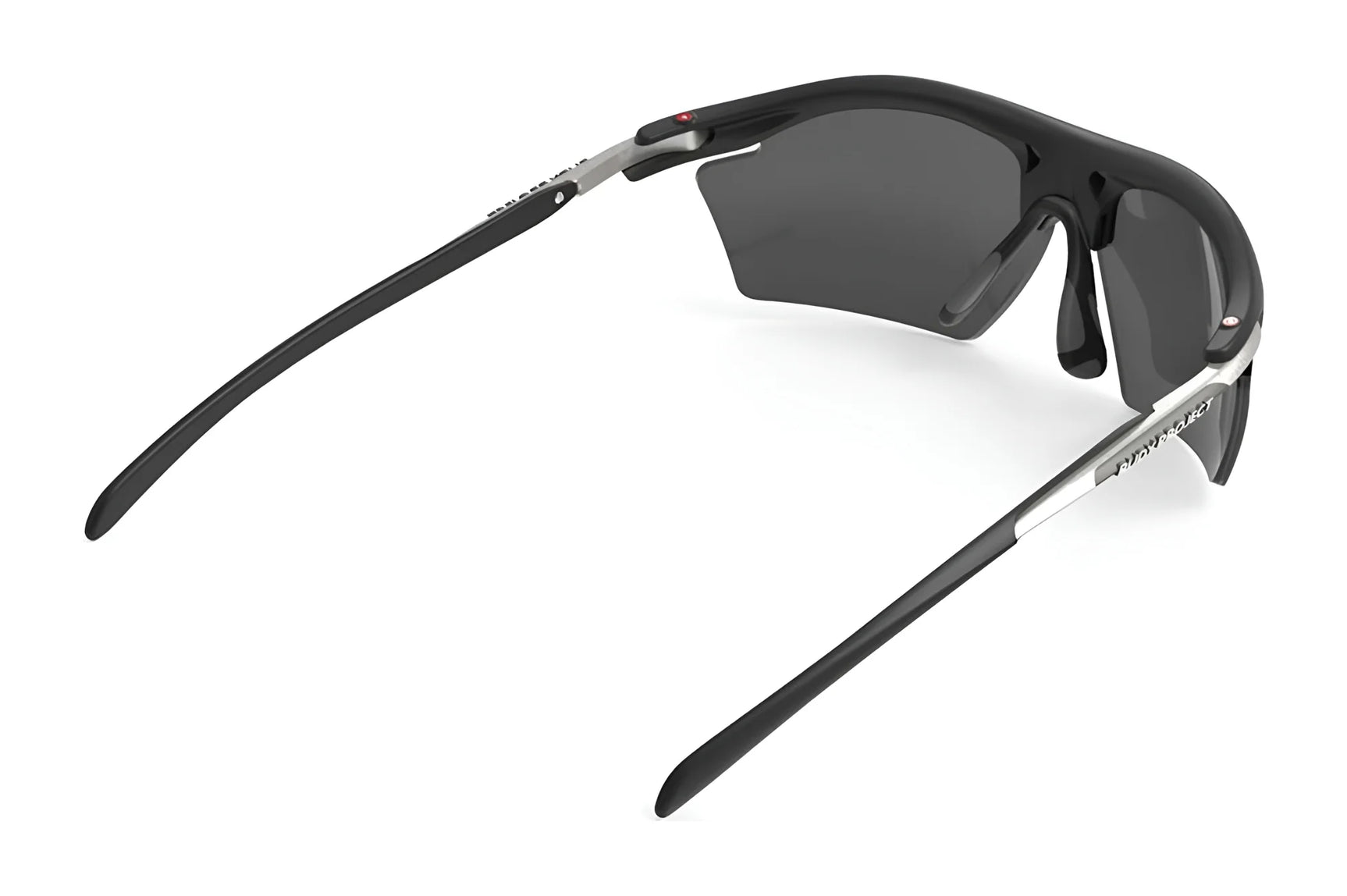 Rudy Project Rydon Slim Sunglasses, shown from a side angle, feature sleek black sports design with dark lenses and offer UV protection for optimal performance on sunny days. Rudy Project Rydon Slim Sunglasses, shown from a side angle, feature sleek black sports design with dark lenses and offer UV protection for optimal performance on sunny days.
