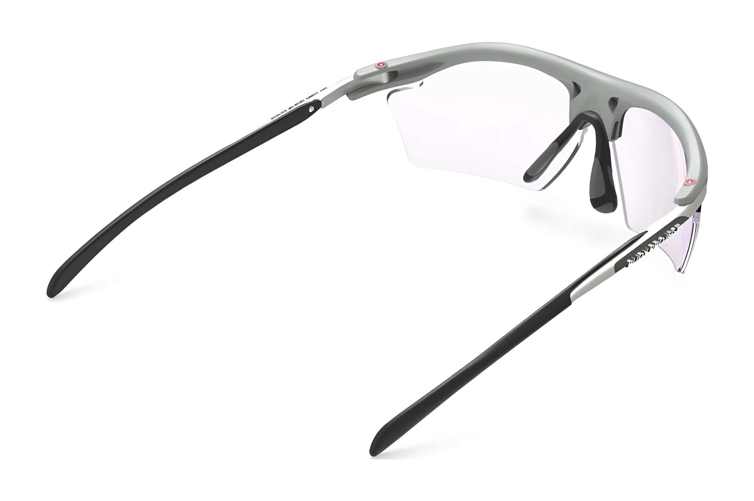 The Rudy Project Rydon Slim Sunglasses in gray and black feature clear lenses for a sleek design and UV protection, shown from a side angle. The Rudy Project Rydon Slim Sunglasses in gray and black feature clear lenses for a sleek design and UV protection, shown from a side angle.