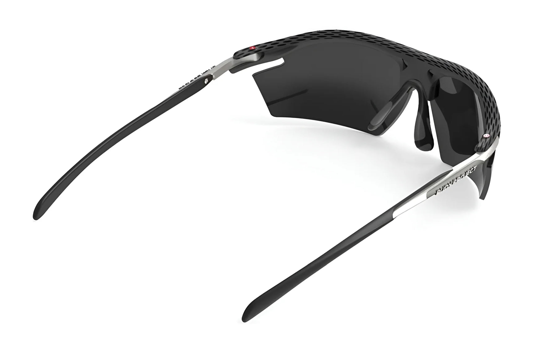 The Rudy Project Rydon Sunglasses by Rudy Project feature a black and silver curved frame, dark lenses, and adjustable anti-slip nosepads, shown from a rear angle. The Rudy Project Rydon Sunglasses by Rudy Project feature a black and silver curved frame, dark lenses, and adjustable anti-slip nosepads, shown from a rear angle.
