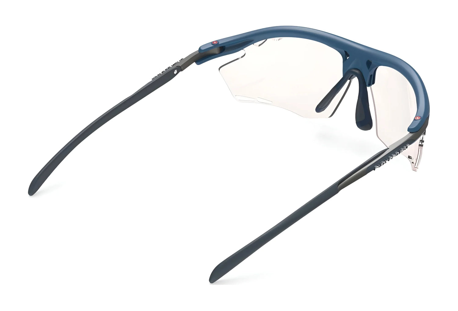 Rudy Project Rydon sunglasses by Rudy Project, featuring blue frames, clear lenses, and adjustable anti-slip nosepads, shown from the rear on a white background. Rudy Project Rydon sunglasses by Rudy Project, featuring blue frames, clear lenses, and adjustable anti-slip nosepads, shown from the rear on a white background.