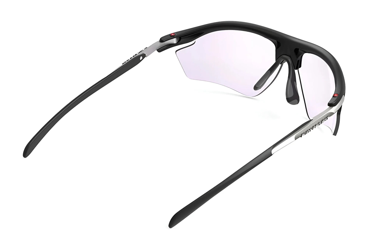 The Rudy Project Rydon Sunglasses by Rudy Project feature black frames, slightly tinted lenses, adjustable anti-slip nosepads, and are shown from a rear side angle for a secure, comfortable fit. The Rudy Project Rydon Sunglasses by Rudy Project feature black frames, slightly tinted lenses, adjustable anti-slip nosepads, and are shown from a rear side angle for a secure, comfortable fit.
