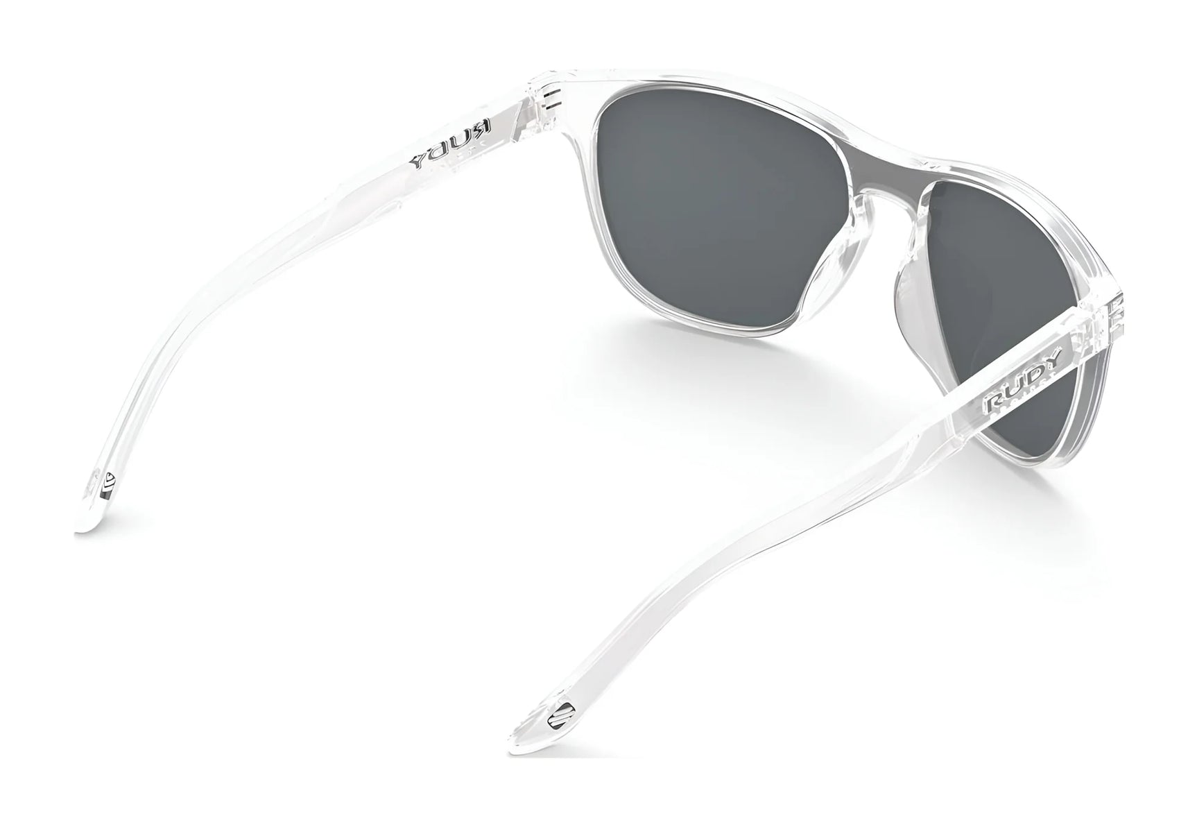 Rudy Project Soundshield Sunglasses | Size 126, clear-frame with dark lenses, designed for active lifestyles, shown from a rear side angle on a white background. Rudy Project Soundshield Sunglasses | Size 126, clear-frame with dark lenses, designed for active lifestyles, shown from a rear side angle on a white background.