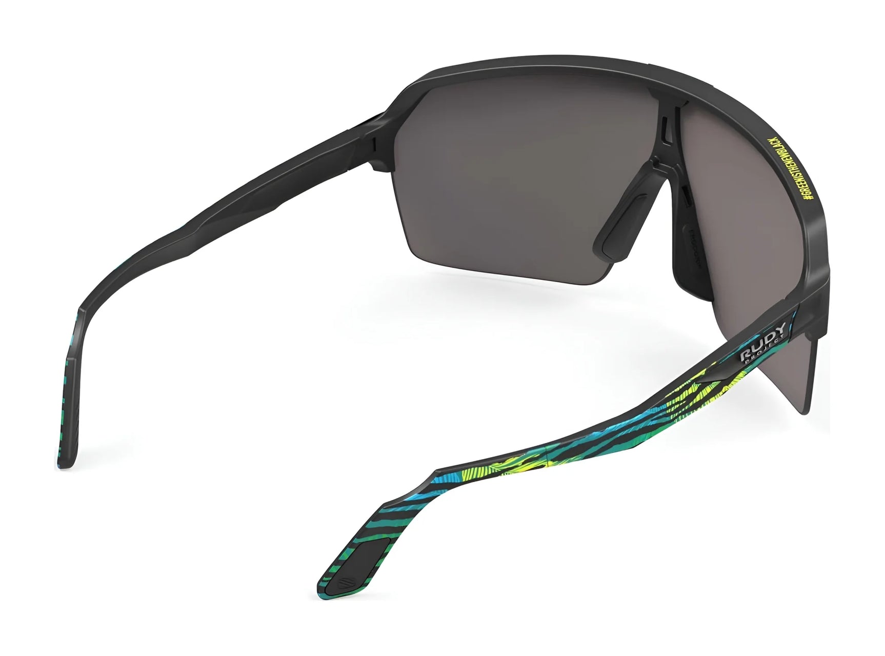The Rudy Project Spinshield Air Sunglasses (Size 147) feature a black and green pattern, dark UV-protective lenses, and are shown from the back and side angles. The Rudy Project Spinshield Air Sunglasses (Size 147) feature a black and green pattern, dark UV-protective lenses, and are shown from the back and side angles.