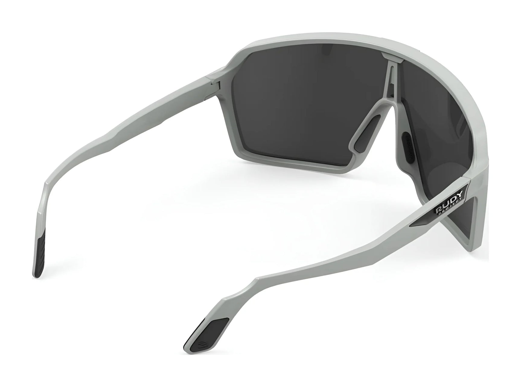 The Rudy Project Spinshield Sunglasses | Size 147 feature gray frames with black lenses, shown from the side and back on a white background, and are designed for eye protection during outdoor sports. The Rudy Project Spinshield Sunglasses | Size 147 feature gray frames with black lenses, shown from the side and back on a white background, and are designed for eye protection during outdoor sports.