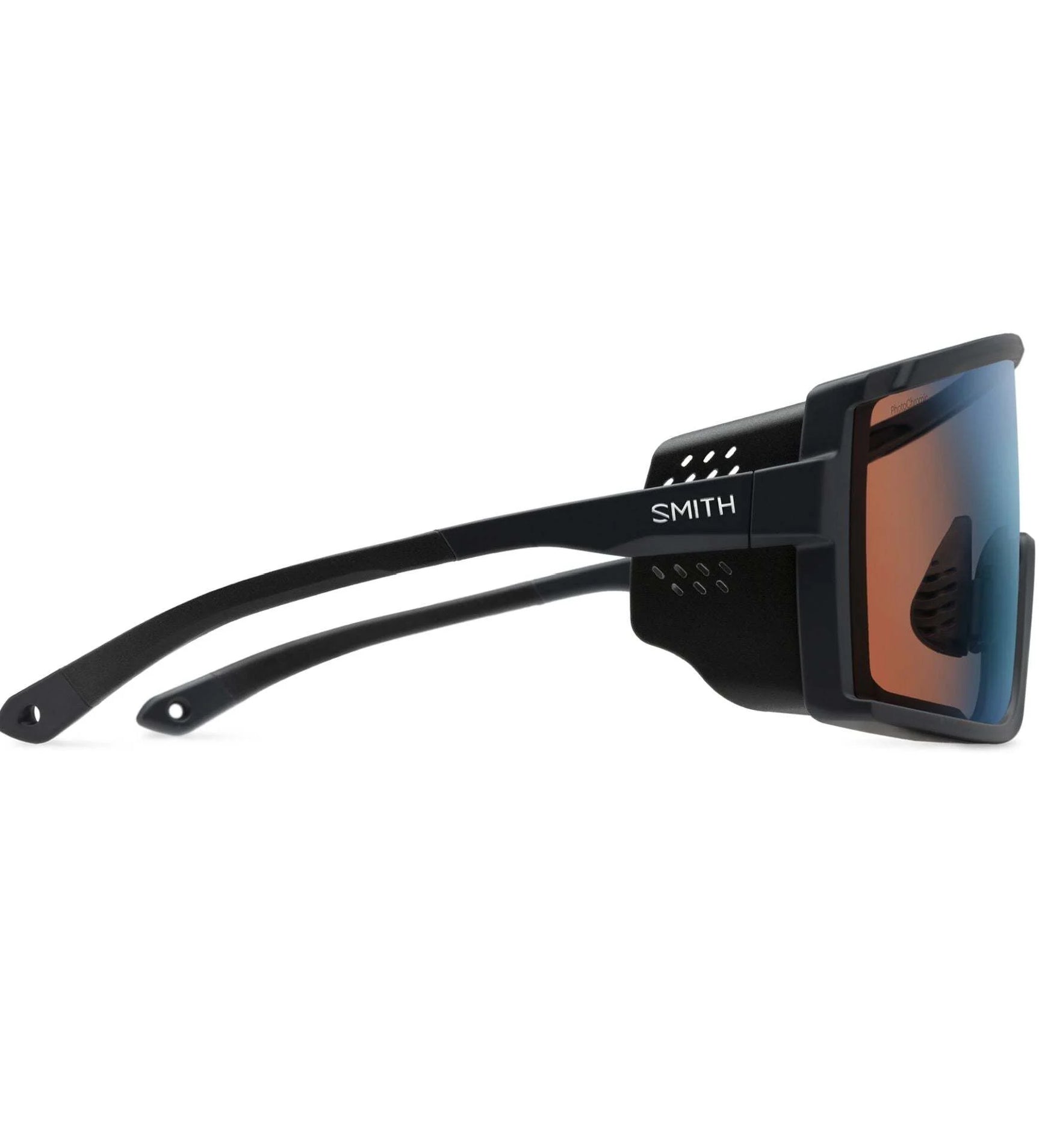 Smith Optics Pursuit Sunglasses featuring side shields and orange ChromaPop™ lenses, with the "Smith Optics" label on the frame. Smith Optics Pursuit Sunglasses featuring side shields and orange ChromaPop™ lenses, with the "Smith Optics" label on the frame.