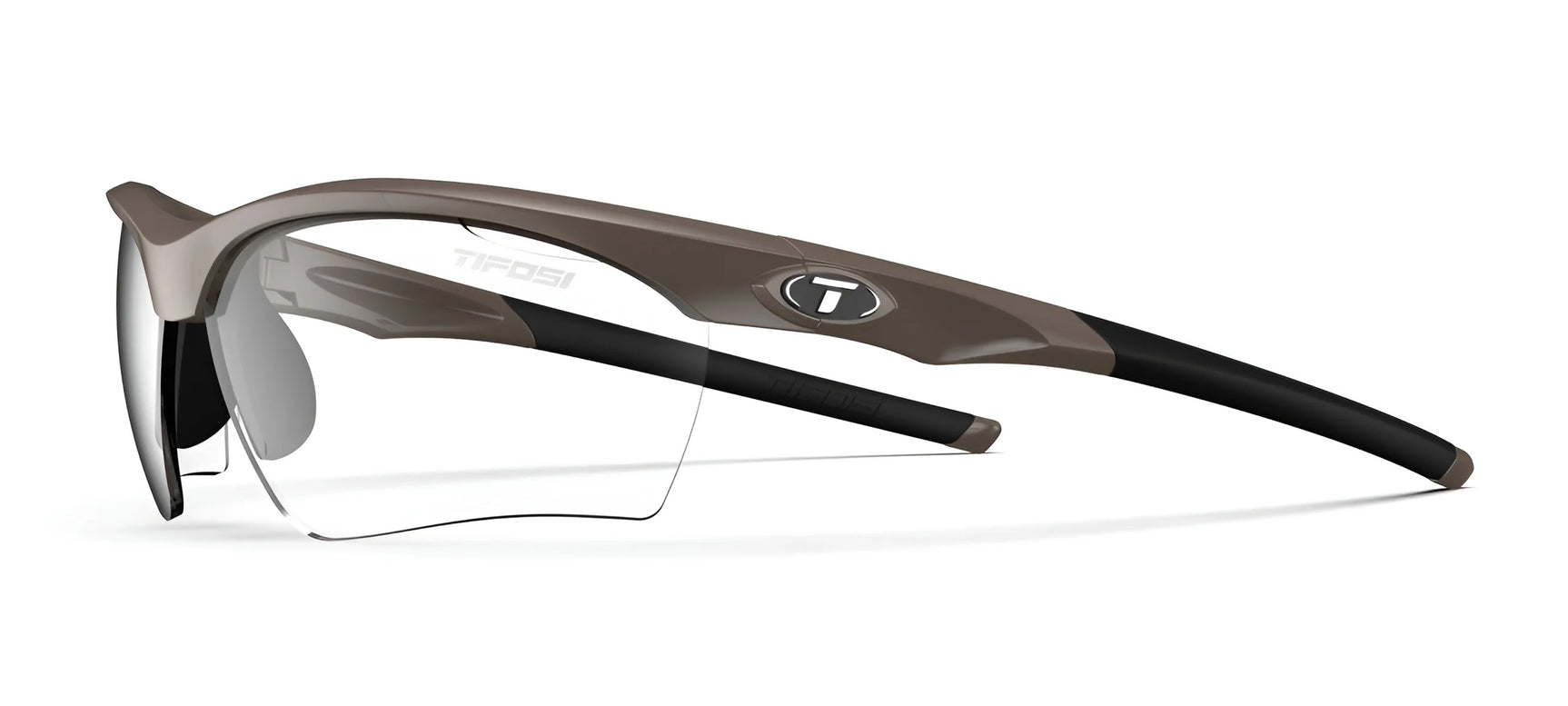 The Tifosi Optics VERO Sunglasses, Size 64, are ideal for multi-sport activities with brown and black frames designed for smaller faces. They feature clear lenses and a distinctive "T" logo on the side. The Tifosi Optics VERO Sunglasses, Size 64, are ideal for multi-sport activities with brown and black frames designed for smaller faces. They feature clear lenses and a distinctive "T" logo on the side.