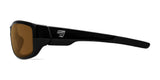 Side view of 7eye Dillon Sunglasses (Size 61) showcasing black frames and shatter-resistant brown lenses with UVA/UVB protection, accented by a geometric logo on the arm.