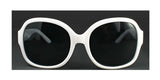 White oversized sunglasses with black lenses, showcasing the polarizing charm of DEA Eyewear DESIRE Sunglasses Size 58, rest elegantly on a dark background.