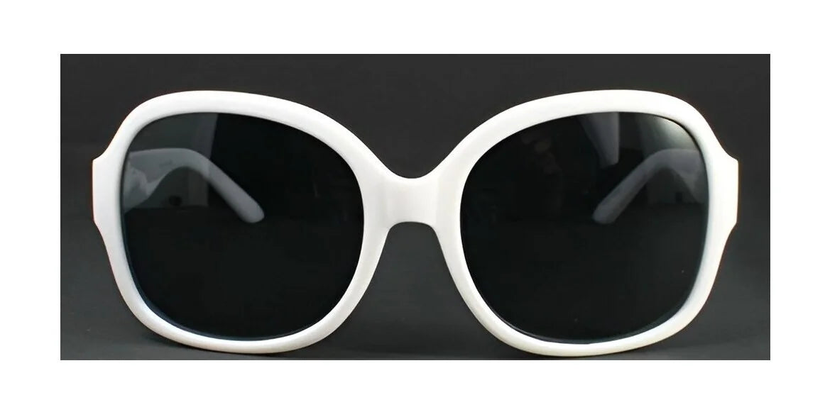 White oversized sunglasses with black lenses, showcasing the polarizing charm of DEA Eyewear DESIRE Sunglasses Size 58, rest elegantly on a dark background.