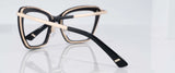 Reflective black and gold-frame Gunnar Anna Computer Glasses with thick rims, offering optimal blue light blocking through GUNNAR lens technology. Size 54.