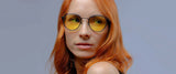 Woman with long red hair wearing Gunnar Atherton Computer Glasses | Size 48, featuring blue light protection from GUNNAR lens technology, looking to the side.