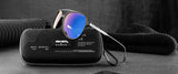 Gunnar Call of Duty Ghost Edition Computer Glasses with blue lenses rest on a black case, accompanied by a black knit hat and sweater.
