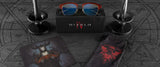 Diablo IV-themed items include Gunnar Diablo IV Sanctuary Edition Computer Glasses (Size 53), featuring a sleek box, a character-adorned mousepad, a mystical pouch, and candles on a dark, symbolic background.