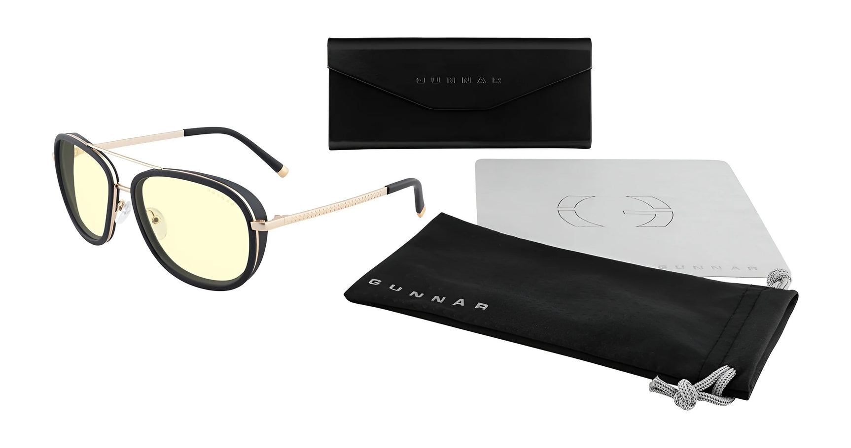 Gunnar Dume Computer Glasses in black and gold feature a sleek stainless steel aviator frame with yellow lenses. Comes with a black case, cleaning cloth, and branded pouch against a white background. Size: 57 by Gunnar.