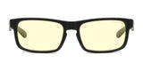 The Gunnar Enigma Computer Glasses, featuring yellow-tinted lenses and black frames, are displayed on a white background. These glasses incorporate Enigma Vision Gaming technology to enhance focus and comfort.