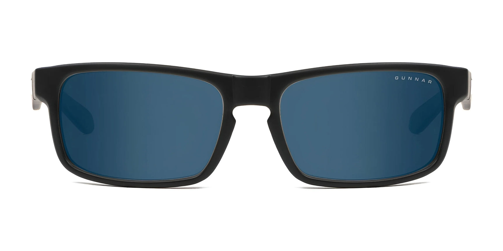 The Gunnar Enigma Sunglasses | Size 58 from Gunnar feature black frames with blue-tinted, wide-format lenses that block UVA and UVB rays, combining style and protection. Photographed frontally on a white background.