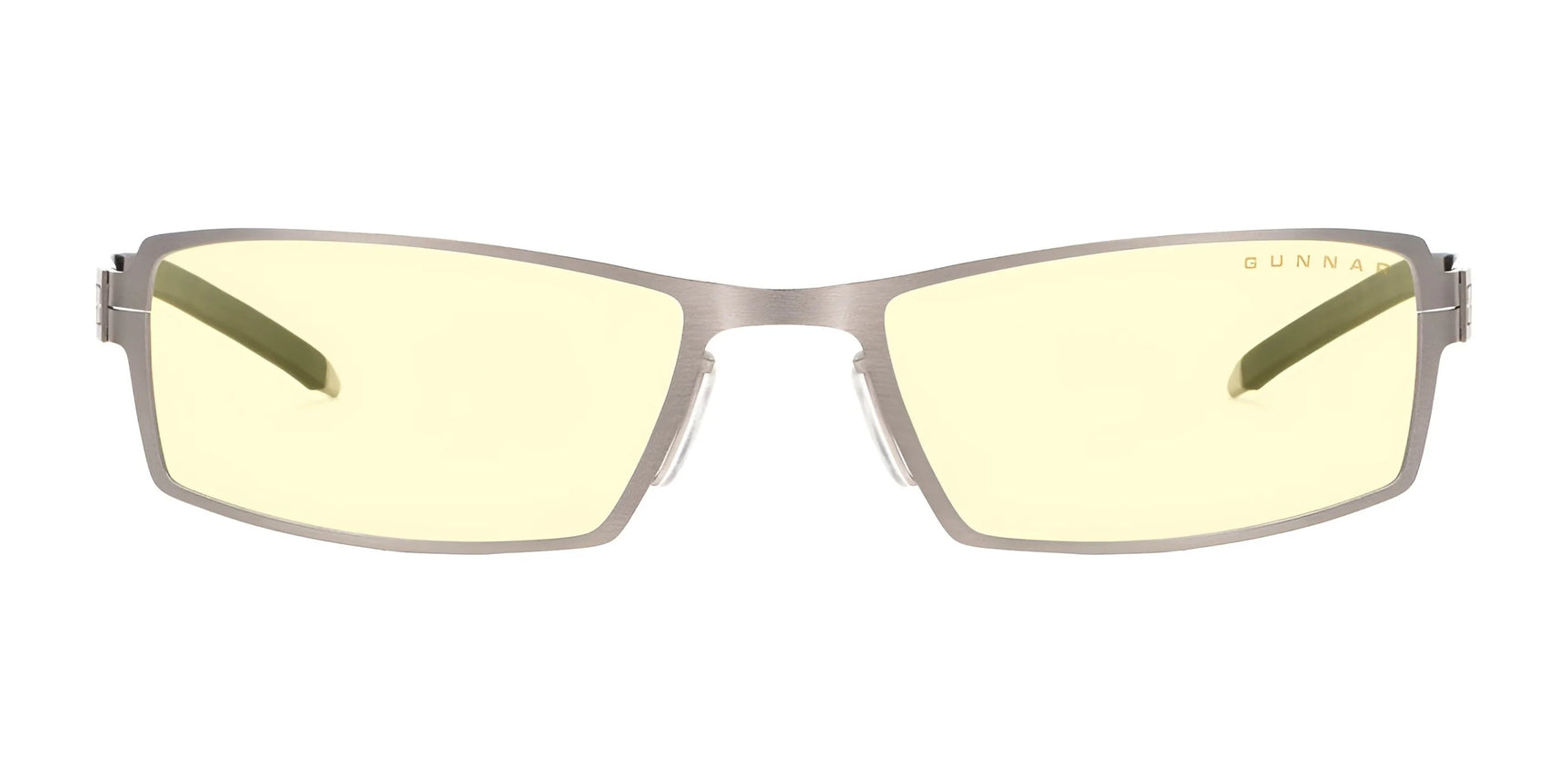 The Gunnar Sheadog Computer Glasses, size 56, feature stylish yellow-tinted lenses in a sleek metal frame. The brand name is elegantly etched on the lens. Made with GUNNAR material, they block blue light and ensure seamless headset compatibility for all-day comfort.