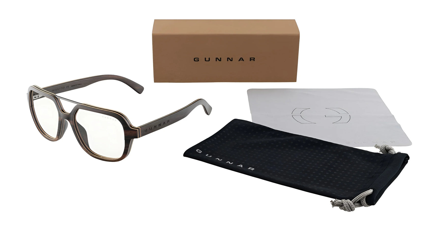 The Gunnar Humboldt Computer Glasses | Size 54 feature an aviator-style brown frame with ebony wood accents, and come with a black pouch, branded box, and cleaning cloth. GUNNAR lens technology ensures visual comfort on a pristine white background.