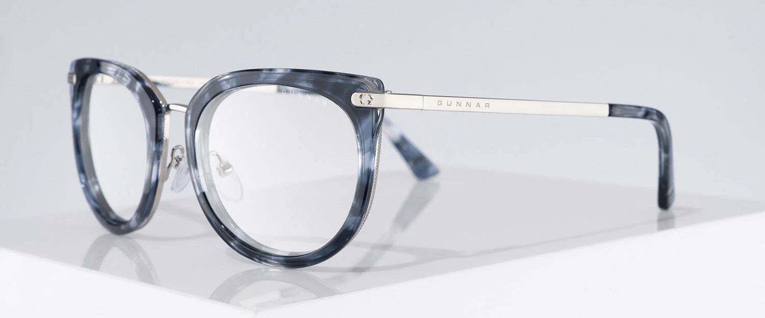 Gunnar Lahti Computer Glasses, size 51, in blue tortoiseshell with silver arms feature GUNNAR lens technology for optimal blue light blocking, rest on a white surface.