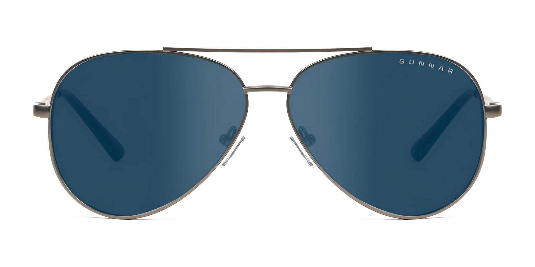 The Gunnar Maverick Sunglasses | Size 58 feature a sleek blue aviator design with thin stainless steel frames and a top bar. The brand name is elegantly displayed on the lens. These sunglasses provide blue light protection, helping to reduce computer eye strain in style.