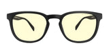 The Gunnar Oakland Computer Glasses, size 53, feature sleek black frames with yellow-tinted lenses designed for blue light protection. Made from durable nylon, these glasses rest elegantly against a white background, blending style and function effortlessly.