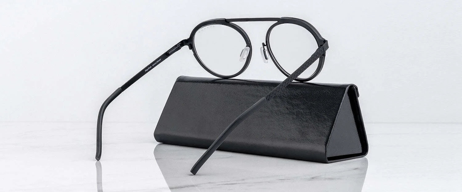 Gunnar's Pacifica Computer Glasses in size 50, designed with a minimalist style, are placed on a black eyeglass case on a marble surface.