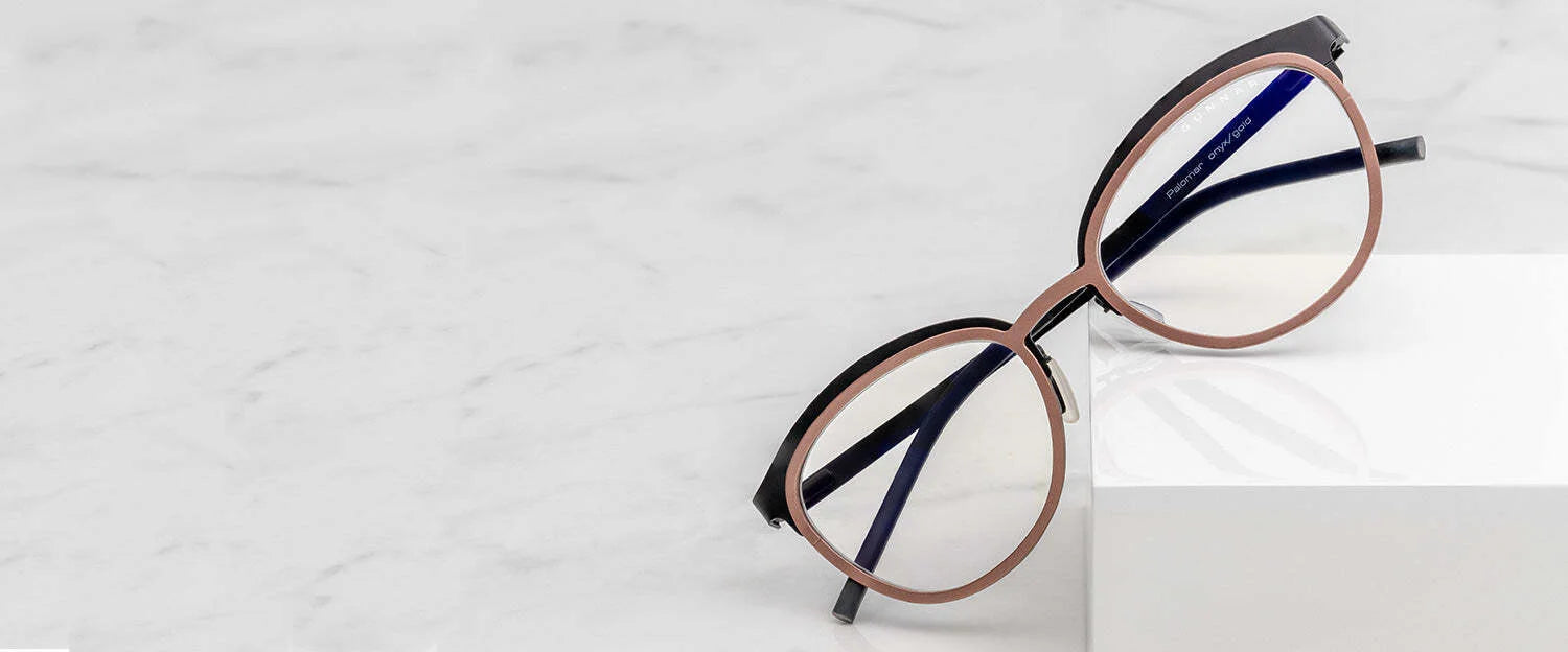 Gunnar Palomar Computer Glasses (Size 51) with thin round frames, designed for blue light blocking, rest elegantly on a white marble surface.