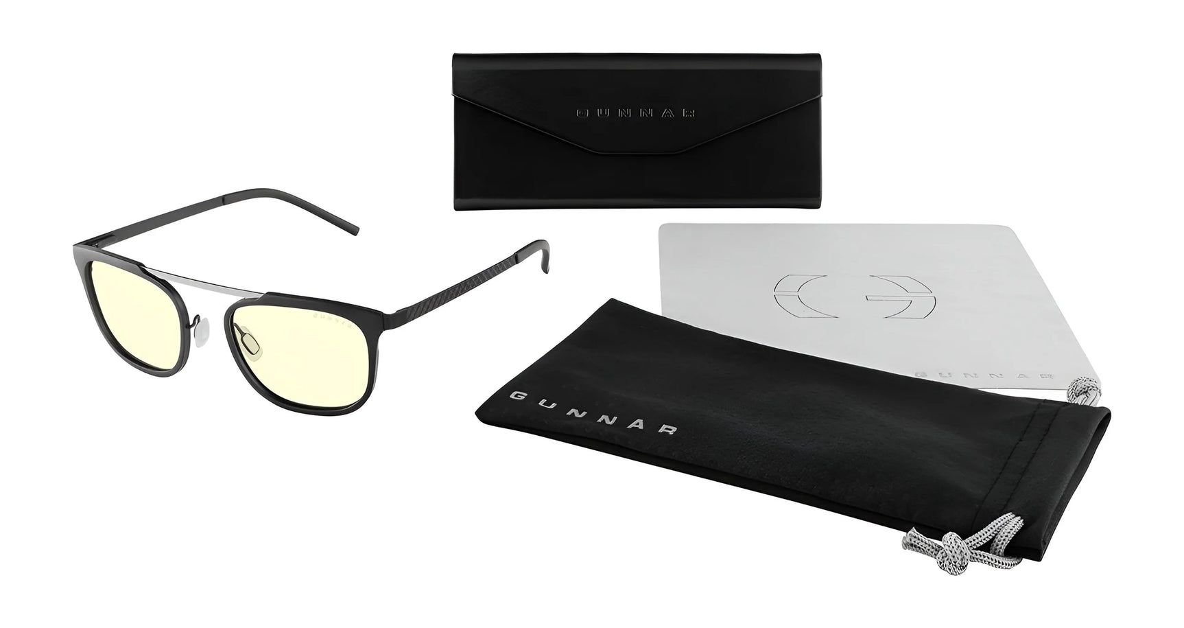 The Gunnar Pismo Computer Glasses, size 50, feature black frames with yellow lenses and come with a sleek black case, cloth pouch, and cleaning cloth. They are perfect for reducing blue light exposure and are elegantly displayed against a white background.