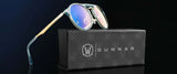 Gunnar World of Warcraft Alliance Edition Computer Glasses with blue-tinted, blue light blocking lenses are showcased on a sleek black Gunnar box against a dark background.