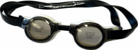 The Barracuda Medalist Swimming Goggles, featuring a black strap and clear lenses with removable protective covers, are ideal for training and competition. Branded with "Barracuda," they are perfect for younger swimmers.