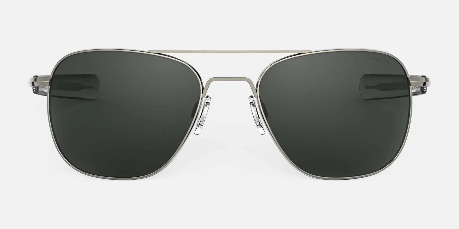 The Randolph AVIATOR Sunglasses, Size 58, feature a sleek silver metal frame and dark lenses, offering superior protection. Handcrafted in the USA, they are elegantly presented against a white background.