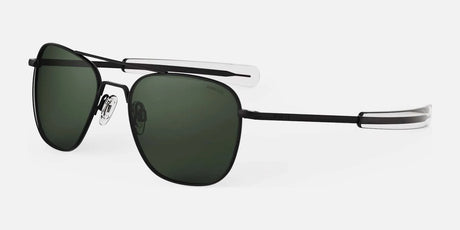 The Randolph AVIATOR Sunglasses in size 58 are expertly handcrafted in the USA, showcasing matte black frames with dark lenses for excellent protection and clear earpieces, all highlighted against a light gray backdrop.