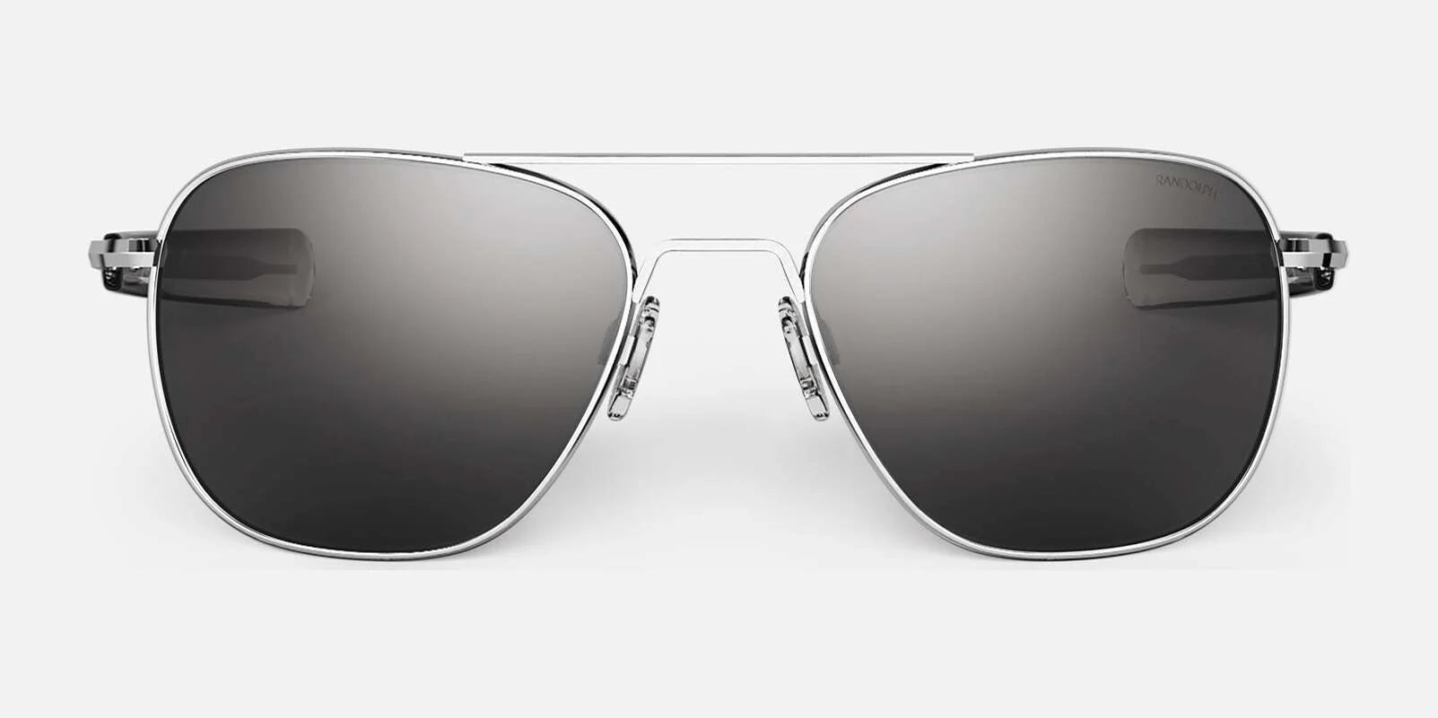 The Randolph AVIATOR Sunglasses, handcrafted in the USA and available in size 58, feature a sleek silver frame with dark lenses on a white background, providing superior protection.