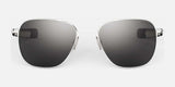 The Randolph AVIATOR Sunglasses in Size 58, featuring thin silver metal frames and dark lenses on a gray background, provide superior protection.