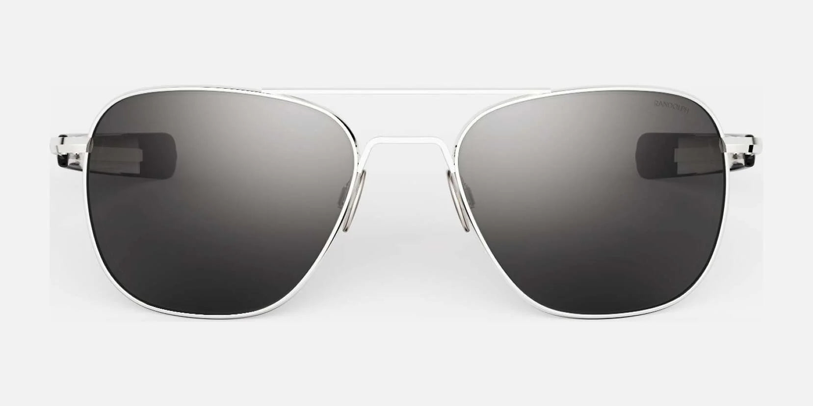 The Randolph AVIATOR Sunglasses in Size 58, featuring thin silver metal frames and dark lenses on a gray background, provide superior protection.