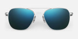 The Randolph AVIATOR Sunglasses, Size 58 by Randolph, showcase blue-green gradient lenses and a sleek silver metal frame. Handcrafted in the USA, these sunglasses provide superior protection against a pristine white backdrop.