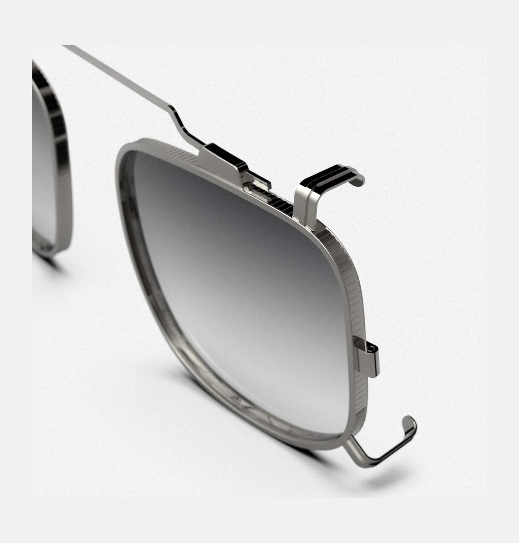 Close-up of Randolph x BKC P-51 Sunglasses Clip-On in size 50, featuring a modern silver frame with gradient gray lenses and a minimalist design, set against a white background.