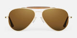 The Randolph SPORTSMAN Sunglasses, featuring gold frames and brown lenses, are ideal for UV protection during outdoor adventures and are displayed on a white background.