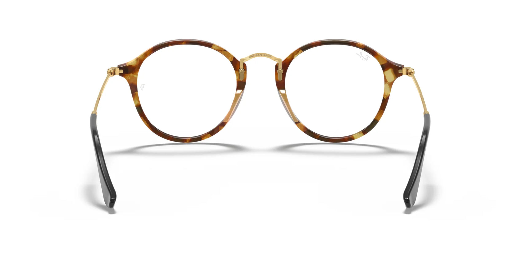 The Ray-Ban ROUND RX2447V Eyeglasses in Size 49, showcasing a classic look with round tortoiseshell frames, are highlighted by black temple tips and golden hinges against a white backdrop.