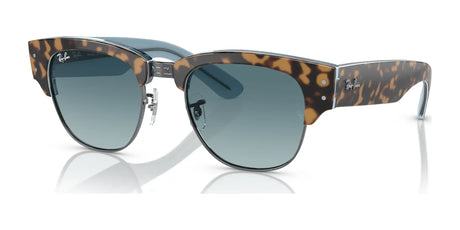 Ray-Ban MEGA CLUBMASTER RB0316S sunglasses in Havana on Blue on Gunmetal №13163M rest elegantly on a reflective surface, showcasing the charm of contemporary eyewear.