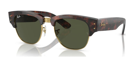 The Ray-Ban MEGA CLUBMASTER RB0316S sunglasses, featuring a Tortoise On Gold №990/31 design and green lenses, rest stylishly on a white surface. These contemporary frames are also prescription-ready for your convenience.