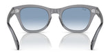 The Ray-Ban RB0707S sunglasses feature a sleek acetate frame with blue gradient, polarized lenses, dazzling on a white surface.