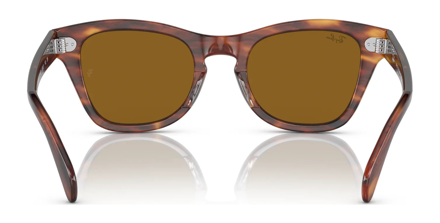 Back view of Ray-Ban RB0707S sunglasses with brown polar lenses and an acetate tortoiseshell frame resting on a reflective surface.