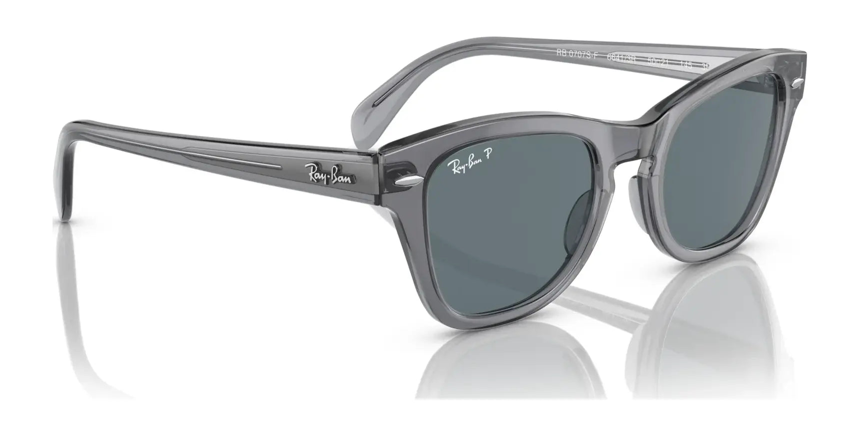 The Ray-Ban RB0707SF Sunglasses in Size 53 offer a stylish design with gray acetate frames and dark lenses. These ensure durability, premium comfort, and excellent UV protection while showcasing the sides and fronts elegantly.