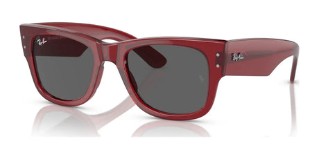 The Ray-Ban MEGA WAYFARER RB0840S sunglasses in red feature dark lenses and the iconic logo on the temples, elegantly displayed on a reflective surface.