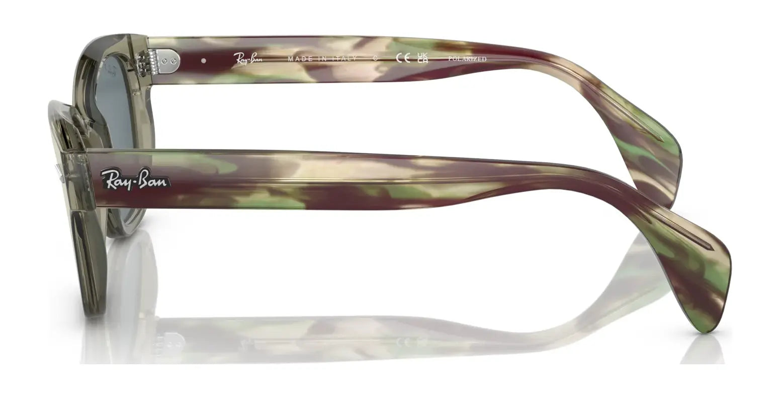 The Ray-Ban RB0880S sunglasses feature a green and brown camo pattern with tinted lenses, providing superior UV protection, as viewed from the side.