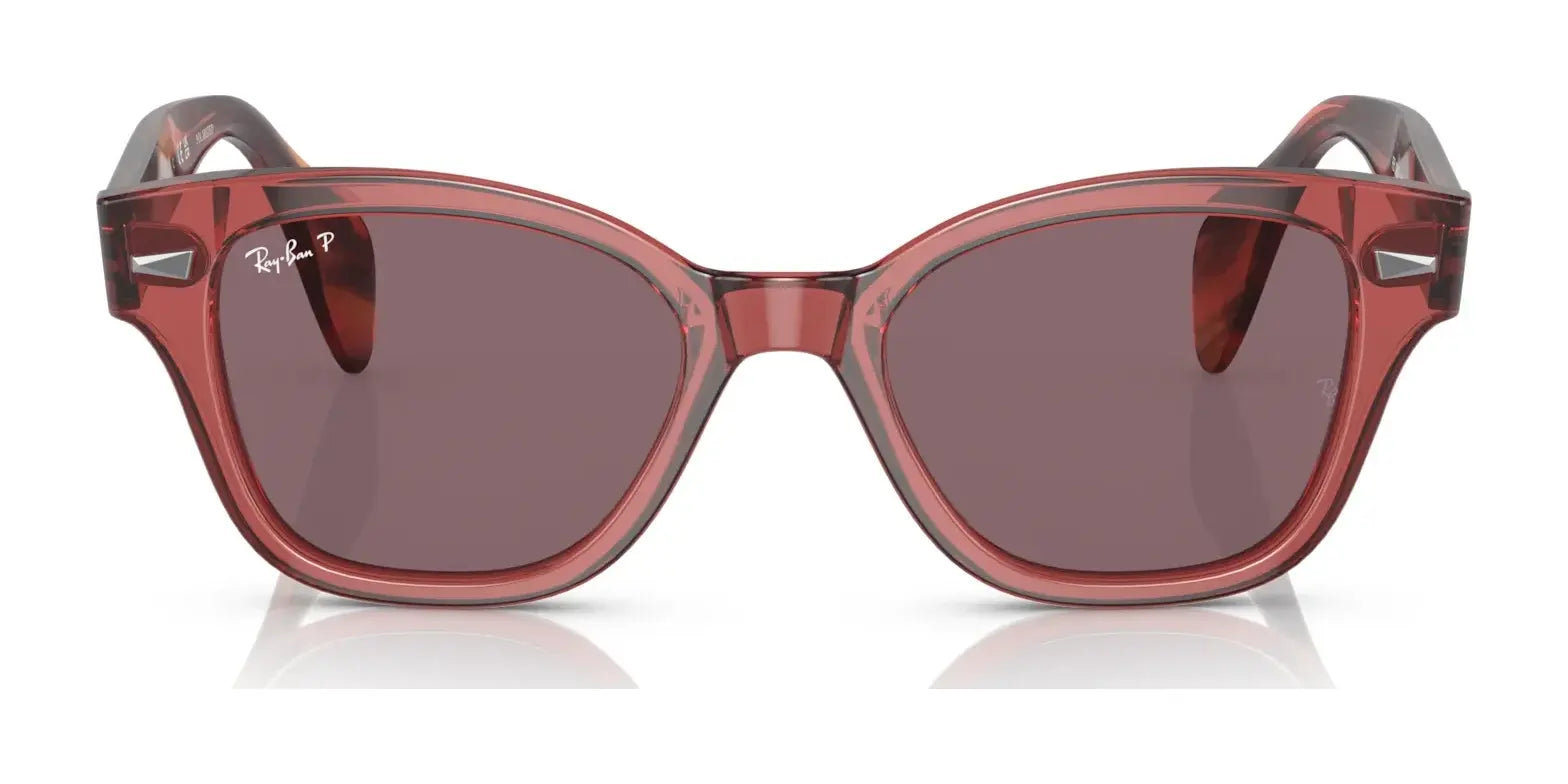 Ray-Ban RB0880S Sunglasses have red square frames with dark lenses and a small logo on the left lens, offering both style and UV protection for sunny days.