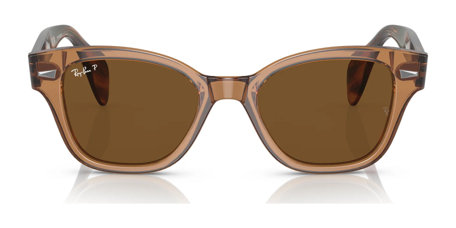 The Ray-Ban RB0880S sunglasses showcase a fashionable brown square frame, tinted lenses with subtle UV protection, and a discreet logo on the upper left lens.